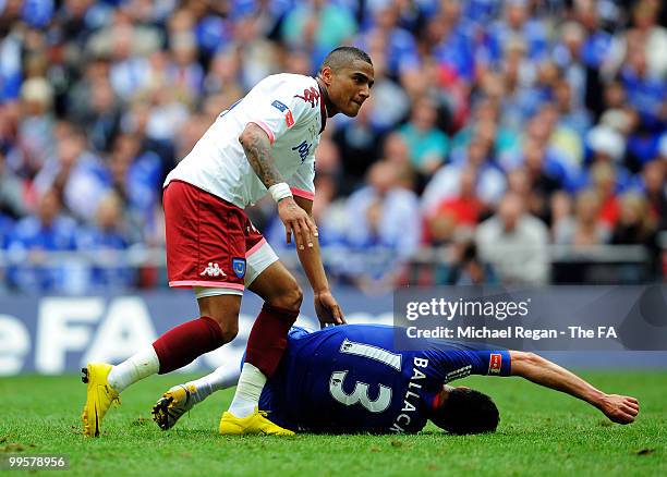 Kevin-Prince Boateng of Portsmouth checks on Michael Ballack of Chelsea after fouling him during the FA Cup sponsored by E.ON Final match between...