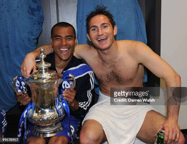 Ashley Cole and Frank Lampard of Chelsea pose with the trophy in the dressing room at the end of the FA Cup sponsored by E.ON Final match between...