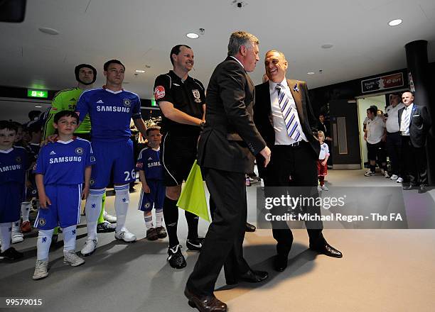 Carlo Ancelotti, manager of Chelsea, and Avram Grant, manager of Portsmouth, talk to each other in the tunnel before leading their teams out at the...