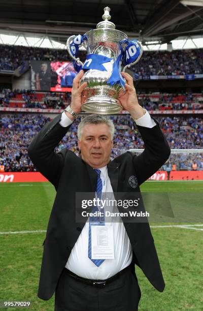 Chelsea Manager Carlo Ancelotti poses with the trophy at the end of the FA Cup sponsored by E.ON Final match between Chelsea and Portsmouth at...