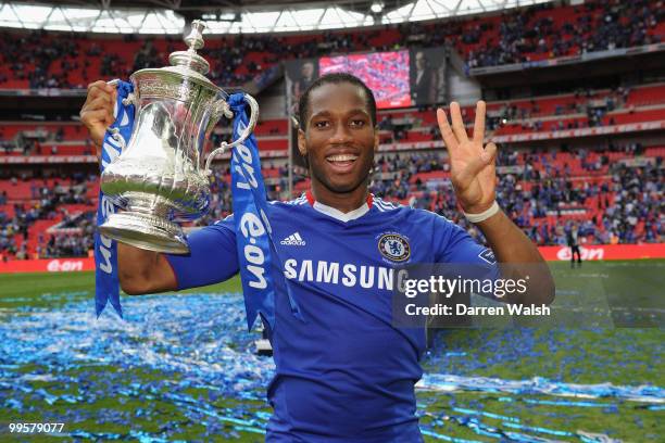 Didier Drogba of Chelsea celebrates with the trophy at the end of the FA Cup sponsored by E.ON Final match between Chelsea and Portsmouth at Wembley...
