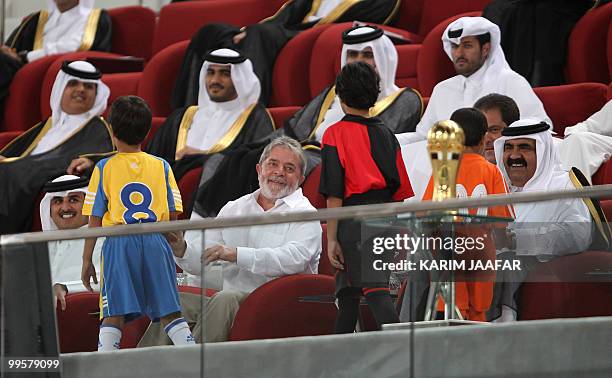 Front row, from L to R: Qatar's Crown Prince Sheikh Tamim bin Hamad bin Khalifa al-Thani, Brazilian President Luiz Inacio Lula da Silva and Qatari...