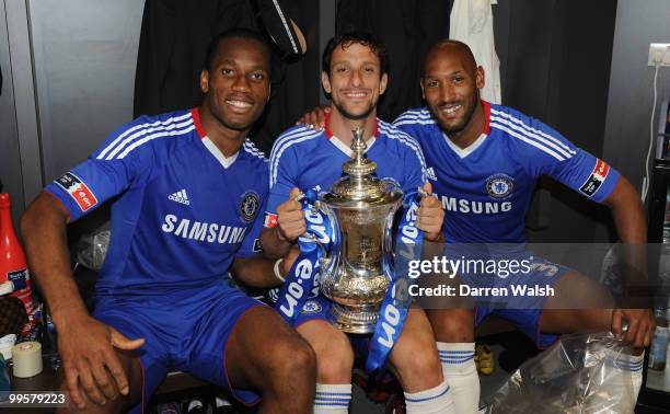 Didier Drogba, Juliano Belletti and Nicolas Anelka of Chelsea celebrate winning the FA Cup sponsored by E.ON Final match between Chelsea and...