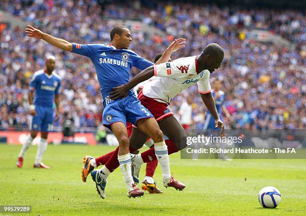 Ashley Cole of Chelsea challenges Papa Bouba Diop of Portsmouth during the FA Cup sponsored by E.ON Final match between Chelsea and Portsmouth at...