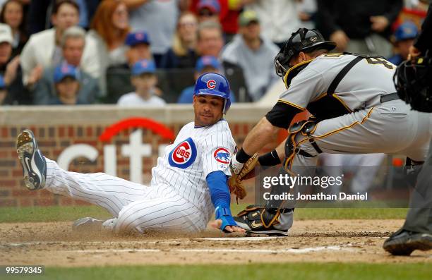 Aramis Ramirez of the Chicago Cubs is tagged out at the plate by Ryan Doumit of the Pittsburgh Pirates in the 3rd inning at Wrigley Field on May 15,...