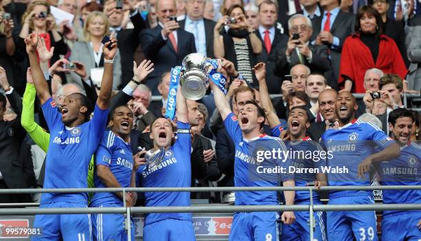 John Terry and Frank Lampard of Chelsea lifts the trophy with team mates following their victory at the end of the FA Cup sponsored by E.ON Final...