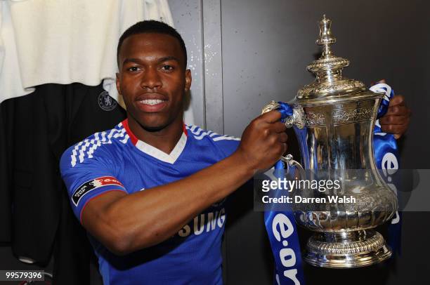 Daniel Sturridge of Chelsea poses with the trophy in the dressing room at the end of the FA Cup sponsored by E.ON Final match between Chelsea and...