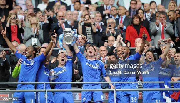 John Terry and Frank Lampard of Chelsea lifts the trophy with team mates following their victory at the end of the FA Cup sponsored by E.ON Final...