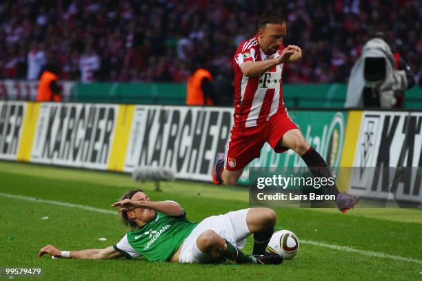 Clemens Fritz of Bremen challenges Franck Ribery of Bayern during the DFB Cup final match between SV Werder Bremen and FC Bayern Muenchen at Olympic...
