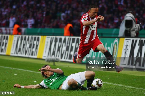 Clemens Fritz of Bremen challenges Franck Ribery of Bayern during the DFB Cup final match between SV Werder Bremen and FC Bayern Muenchen at Olympic...