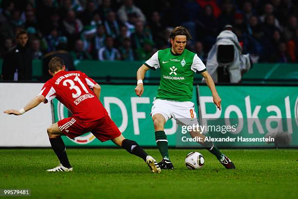 Bastian Scweinsteiger of Bayern and Clemens Fritz of Bremen battle for the ball during the DFB Cup final match between SV Werder Bremen and FC Bayern...