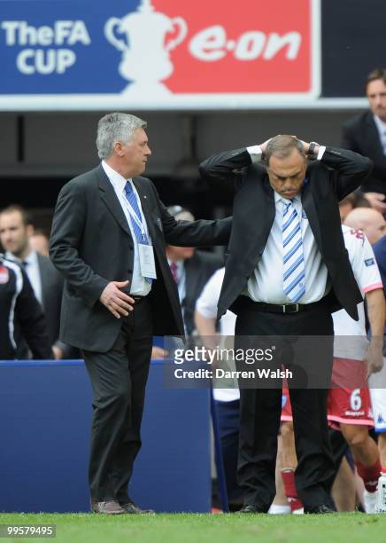 Portsmouth Manager Avram Grant is consoled by Chelsea Manager Carlo Ancelotti at the end of the FA Cup sponsored by E.ON Final match between Chelsea...