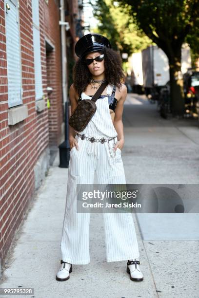 Rachel McGee is seen during July 2018 Men's Fashion week wearing a Forever 21 jump suite and Coach Boots outside of Industria Studios on July 10,...