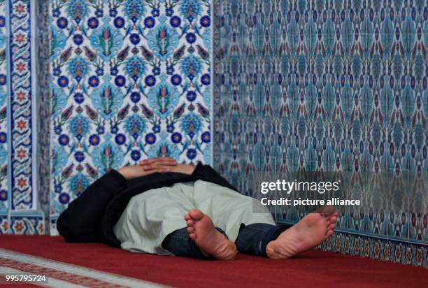 Muslim lying on the floor at the Centrum Moschee in Hamburg, Germany, 3 October 2017. Mosques across Germany opened their doors on 3 October for the...