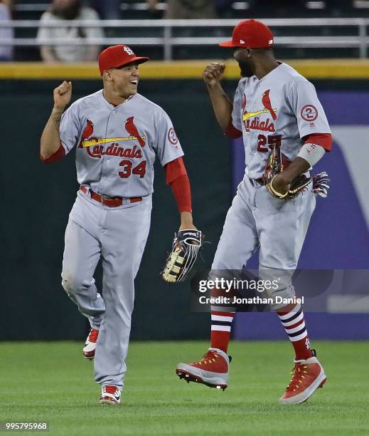 Yairo Munoz and Dexter Fowler of the St. Louis Cardinals celebrate a win over the Chicago White Sox at Guaranteed Rate Field on July 10, 2018 in...