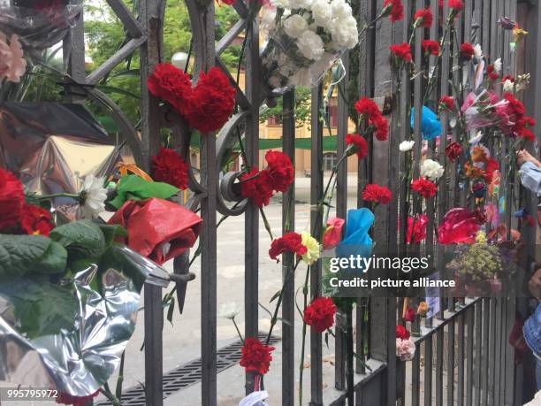 Carnations and roses on the gate of the Ramon Llull school in Barcelona, Spain, 3 October 2017. There was a polling station at the school, where...