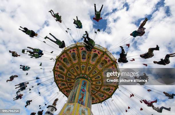 People on a fairground ride on the last day of this year's Oktoberfest at the Theresienwiese in Munich, Germany, 3 October 2017. Photo: Matthias...