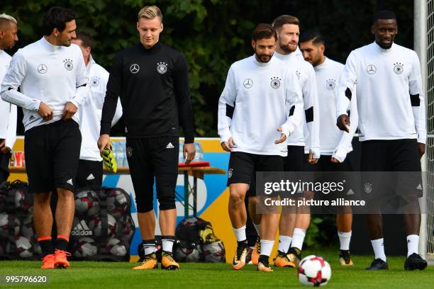 Germany's Mats Hummels, goalie Marc-Andre ter Stegen, Marvin Plattenhardt, Shkodran Mustafi, Emre Can and Antonio Ruediger arrive for a training...