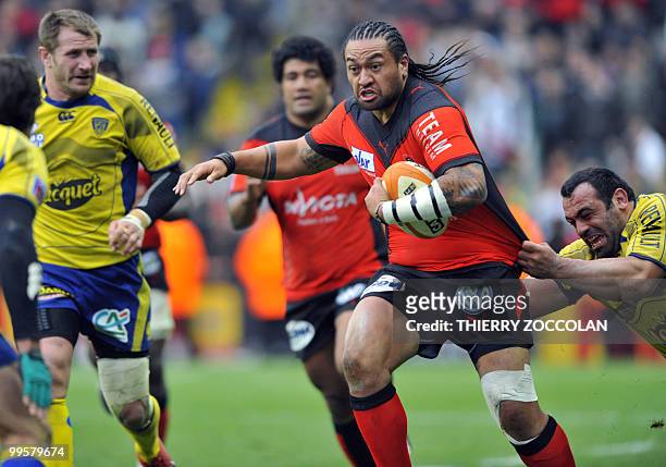 Toulon's Fotunuupule Auelua is tackled by Clermont's Davit Zrakashvili during the French Top 14 semi final rugby union match Clermont-Ferrand versus...