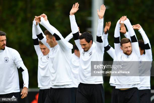 Germany's Sandro Wagner, Matthias Ginter, Niklas Suele, Mats Hummels and Shkodran Mustafi warm up during a training session of the German national...