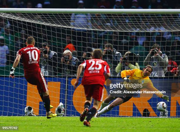 Arjen Robben scores his team's first goal via penalty against goalkeeper Tim Wiese of Bremen during the DFB Cup final match between SV Werder Bremen...