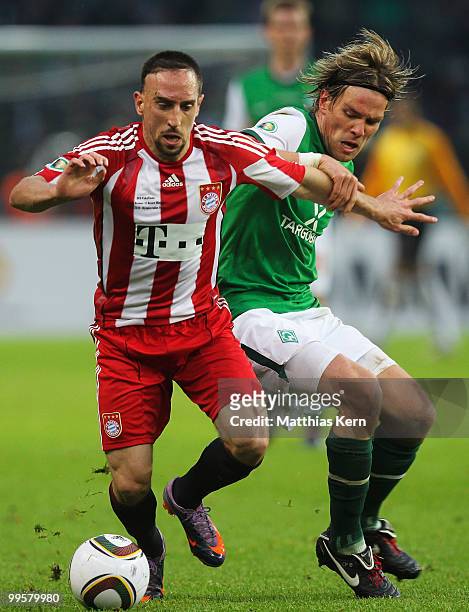 Franck Ribery of Bayern battles for the ball with Clemens Fritz of Bremen during the DFB Cup final match between SV Werder Bremen and FC Bayern...