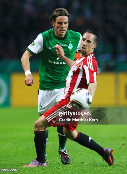 Clemens Fritz of Bremen battles for the ball with Franck Ribery of Bayern during the DFB Cup final match between SV Werder Bremen and FC Bayern...