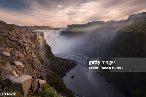 the dettifoss waterfall at sunset in iceland. - dettifoss waterfall foto e immagini stock