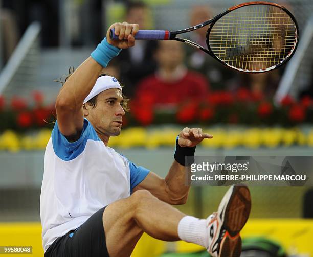 Spain's David Ferrer returns a ball against Swiss Roger Federer during their semi-final match of the Madrid Masters on May 15, 2010 at the Caja Magic...