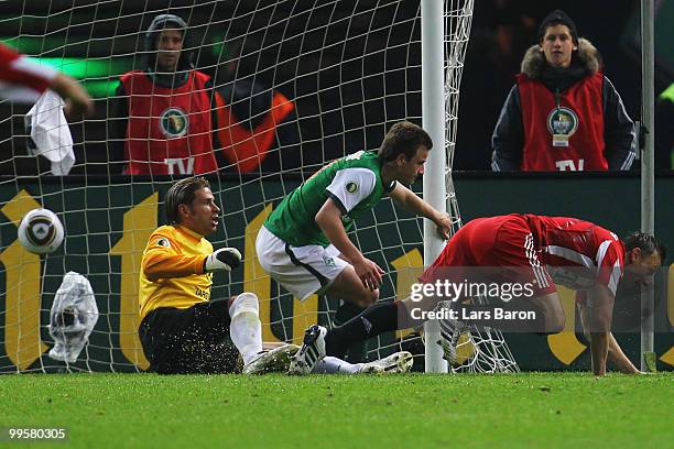 Ivica Olic of Bayern scores the second goal against goalkeeper Tim Wiese of Bremen during the DFB Cup final match between SV Werder Bremen and FC...