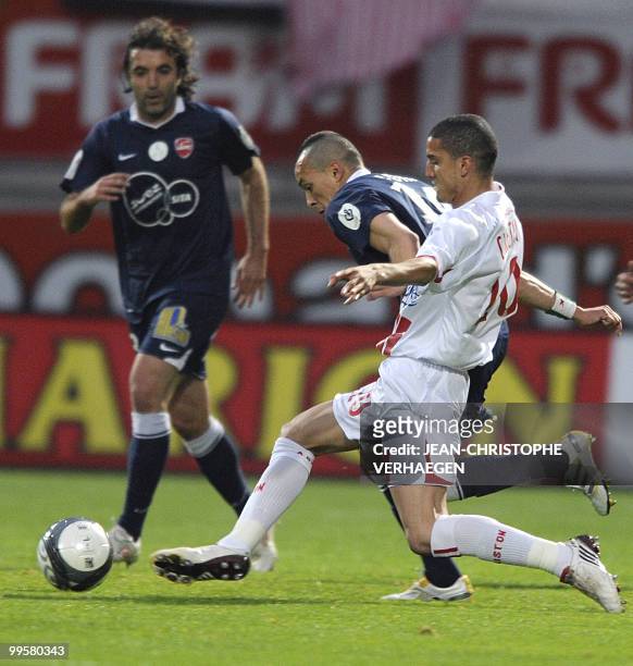 Nancy's Moroccan defender Michael Chretien fights for the ball with Valencienne's French midfielder Foued Kadir during their French L1 football match...