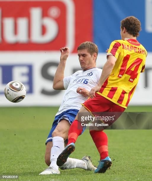 Marcin Kowalczyk of FC Dynamo Moscow battles for the ball with Aleksandr Marenich of FC Alania Vladikavkaz during the Russian Football League...