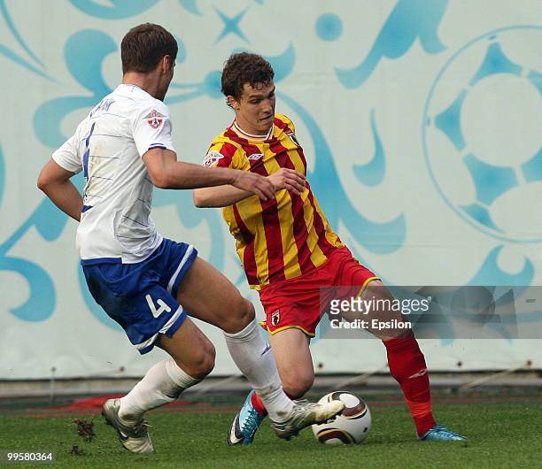 Marcin Kowalczyk of FC Dynamo Moscow battles for the ball with Aleksandr Marenich of FC Alania Vladikavkaz during the Russian Football League...