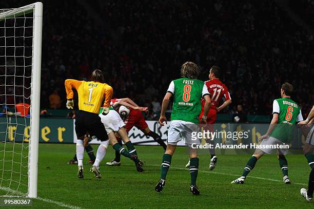 Ivica Olic of Bayern scores his team's second goal during the DFB Cup final match between SV Werder Bremen and FC Bayern Muenchen at Olympic Stadium...
