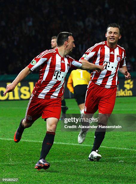 Franck Ribery of Bayern celebrates after scoring his team's third goal with team mate Ivica Olic during the DFB Cup final match between SV Werder...