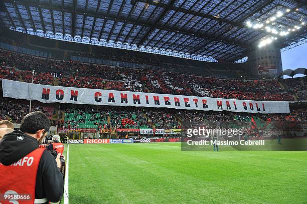 Fans of AC Milan show a banner "you'll never walk alone" during the Serie A match between AC Milan and Juventus FC at Stadio Giuseppe Meazza on May...