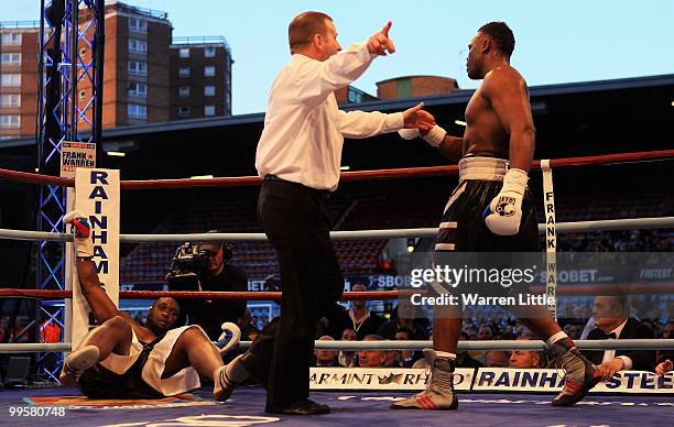 Danny Williams is knock down by Dereck Chisora during The British Heavyweight Championship at Boleyn Ground on May 15, 2010 in London, England.