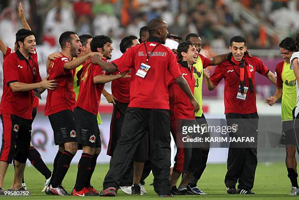 Al-Rayyan's players celebrate after beating Umm Salal 1-0 in the Qatari's clubs' Emir Cup final football match in Doha on May 15, 2010. AFP...