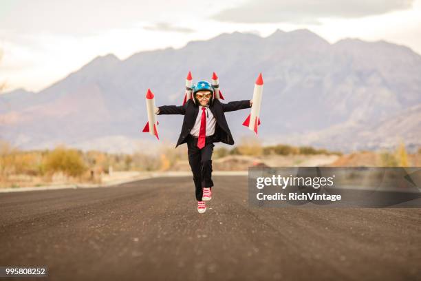 young business boy with rockets - adult imitation stock pictures, royalty-free photos & images