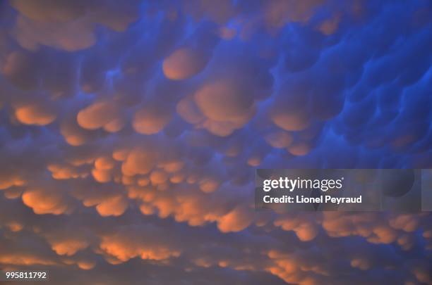mammatus clouds at sunset - mammatus cloud stock pictures, royalty-free photos & images