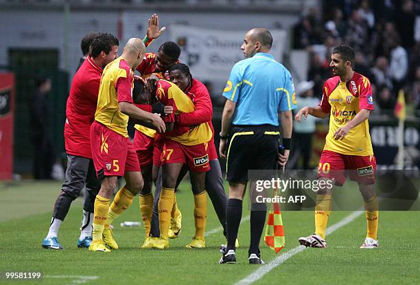 Lens' Malian midfielder Samba Sow is congratulated by team-mates during the French L1 football match Lens vs. Bordeaux on May 15, 2010 at the...