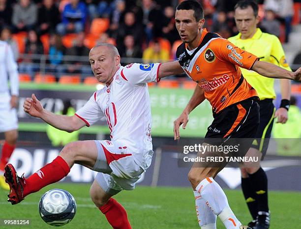 Lorient's midfielder Morgan Amalfitano vies with Lille's midfielder Florent Balmont during the French L1 football match Lorient vs. Lille on May 15,...