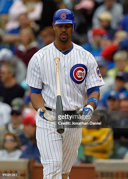 Derrek Lee of the Chicago Cubs flips his bat after striking out in the 8th inning against the Pittsburgh Pirates at Wrigley Field on May 15, 2010 in...