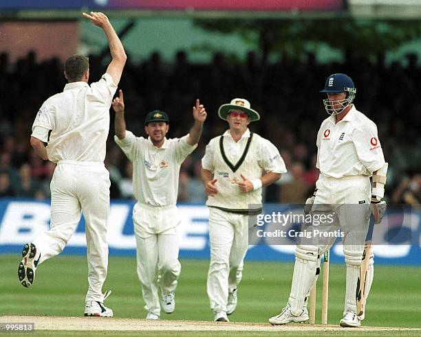 Dejected Alec Stewart of England heads back to the pavilion after losing his wicket to Glenn McGrath of Australia during the fourth day of the Second...