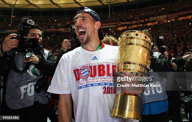 Franck Ribery of Bayern presents the trophy after winning the DFB Cup final match between SV Werder Bremen and FC Bayern Muenchen at Olympic Stadium...