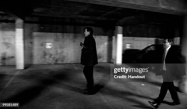 In this handout image provided by the Conservative Party, Leader of the Conservative Party David Cameron walks to his car at CCHQ as he goes to meet...