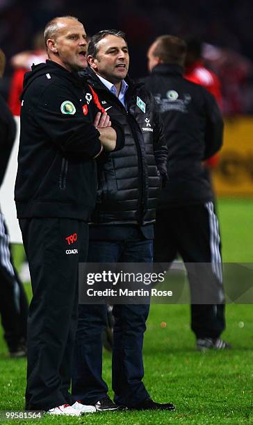 Head coach Thomas Schaaf and manager Klaus Allofs look on after loosing the DFB Cup final match between SV Werder Bremen and FC Bayern Muenchen at...