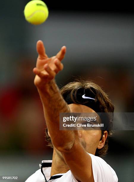 Roger Federer of Switzerland prepares to serve against David Ferrer of Spain in their semi final match during the Mutua Madrilena Madrid Open tennis...