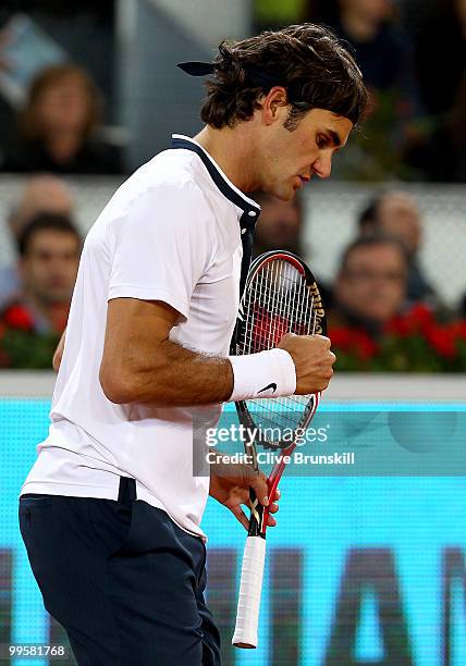 Roger Federer of Switzerland celebrates a point against David Ferrer of Spain in their semi final match during the Mutua Madrilena Madrid Open tennis...