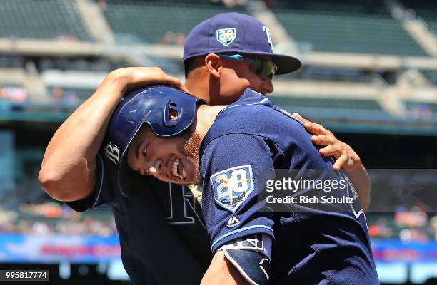 Cron of the Tampa Bay Rays is congratulated by Carlos Gomez after hitting a three run home run against the New York Mets during the first inning of a...